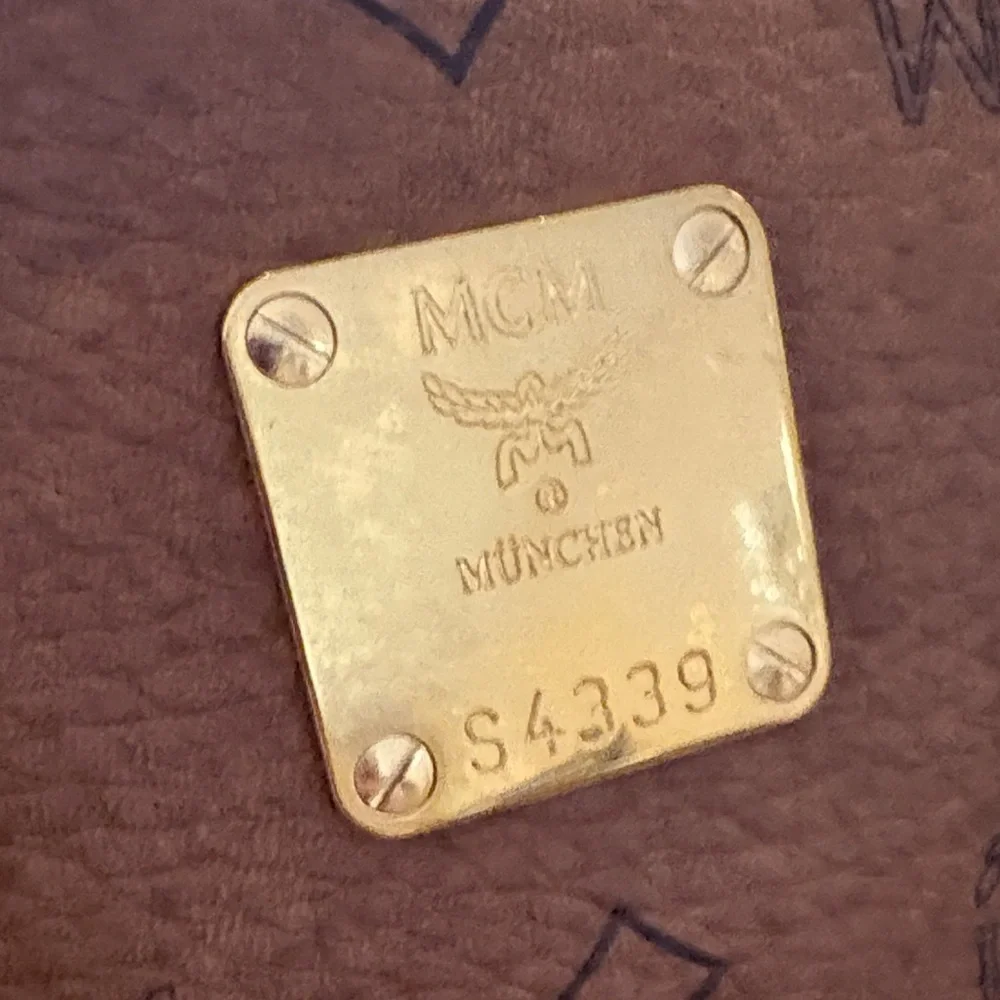 MCM Visetos Brown Boston Bag with Dog Bone Charm